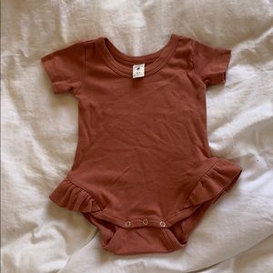 Kate Quinn ruffle onesie
